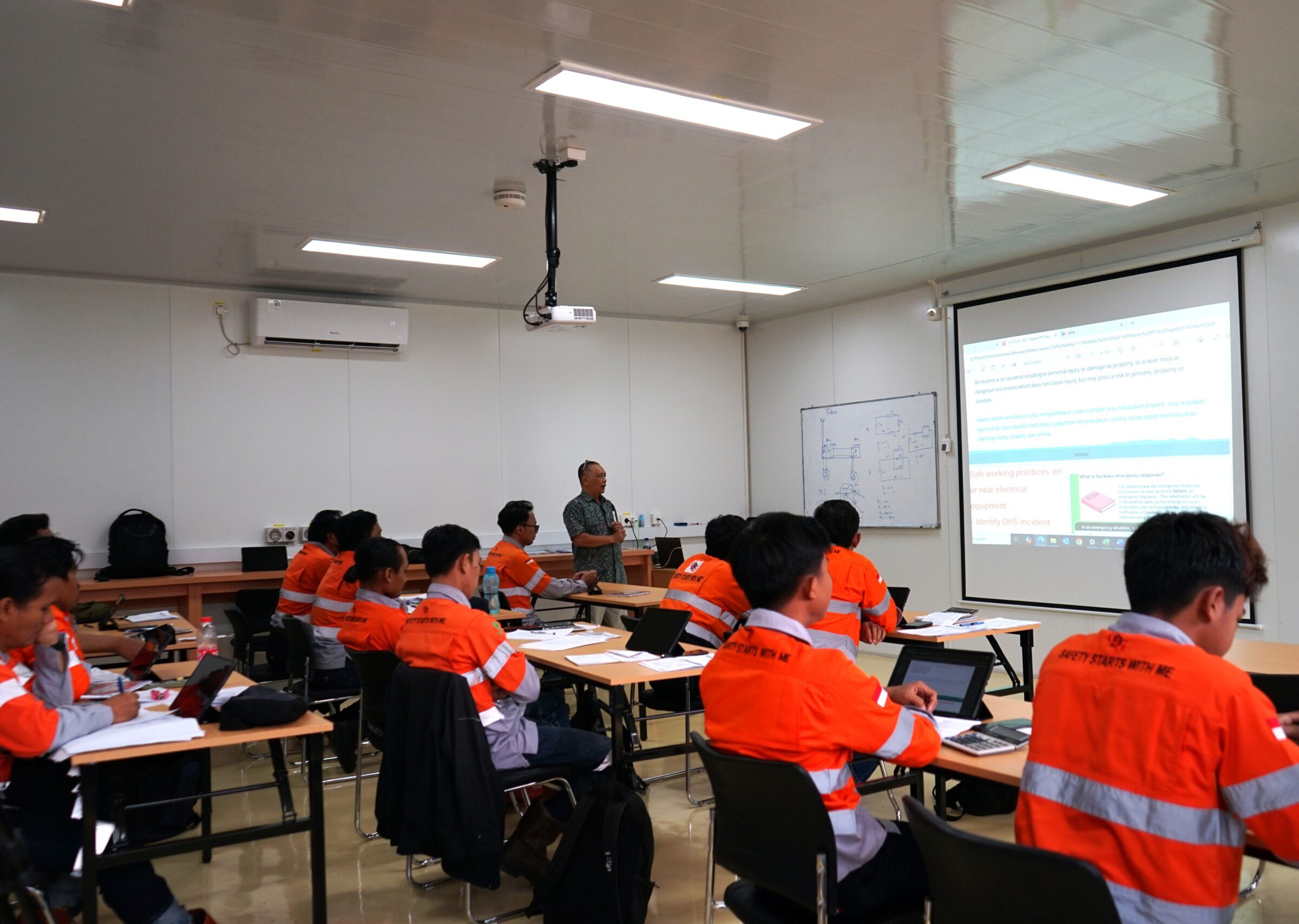 Electrical students in classroom learning about electrotechnology